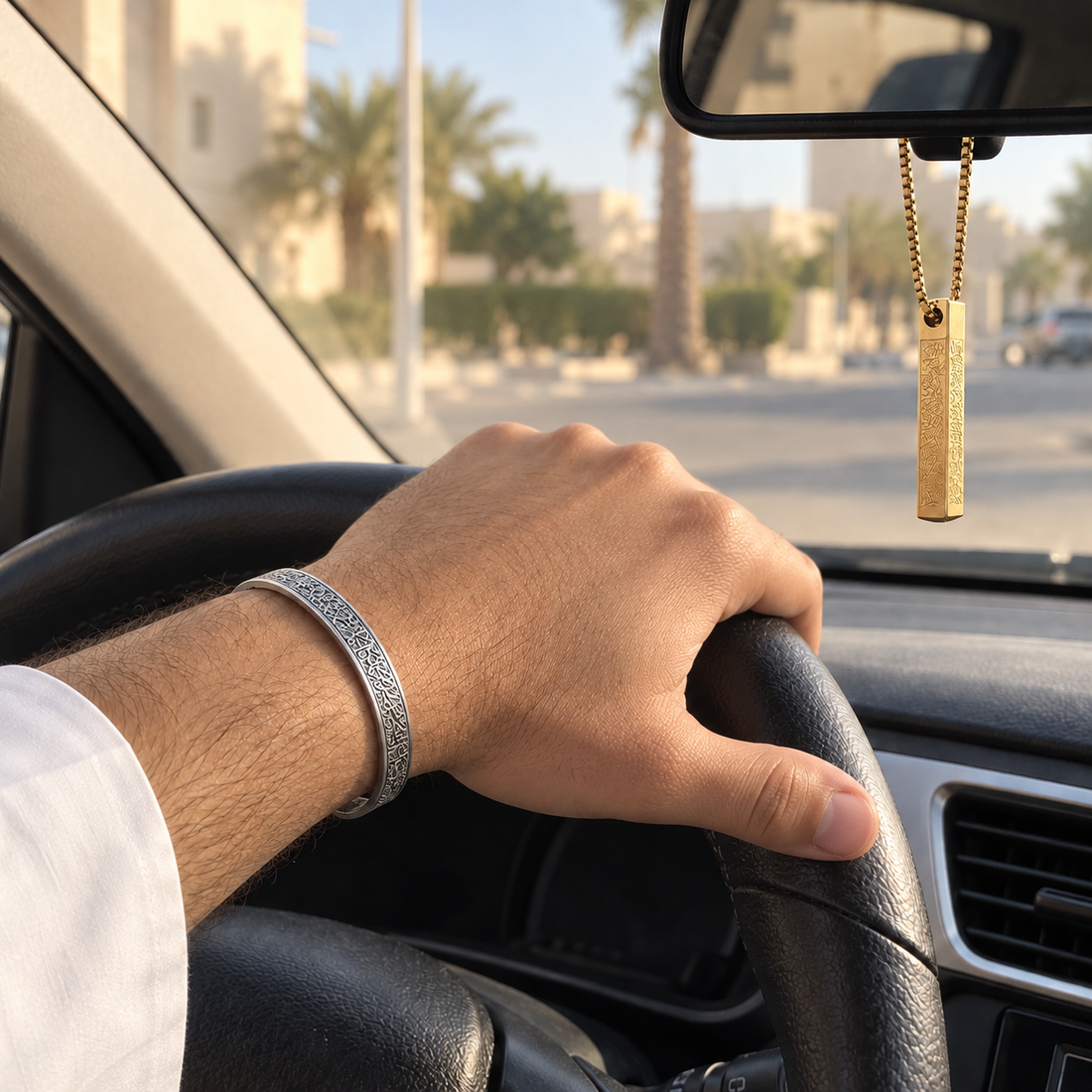 Silver bangle worn while driving