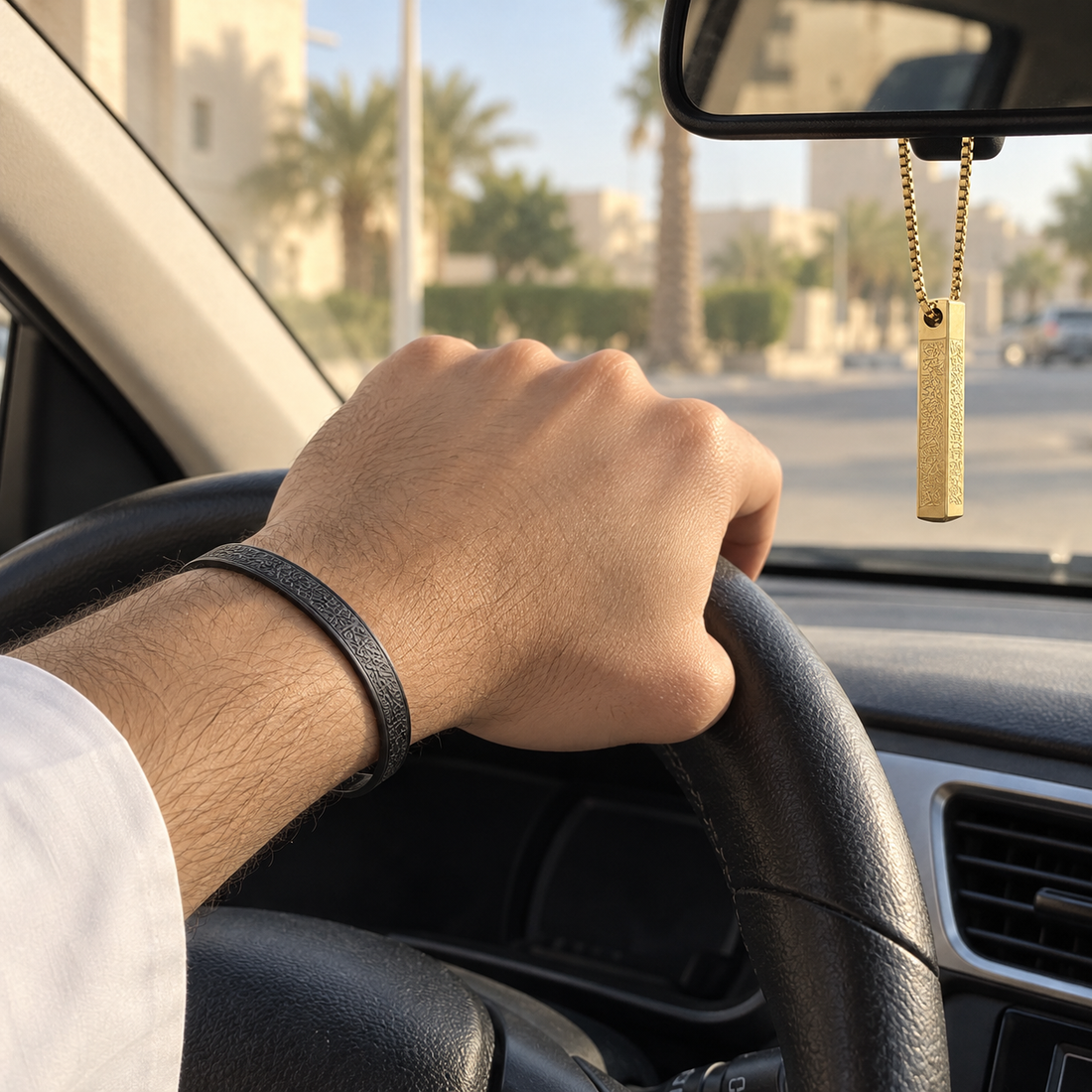 Black bangle worn while driving