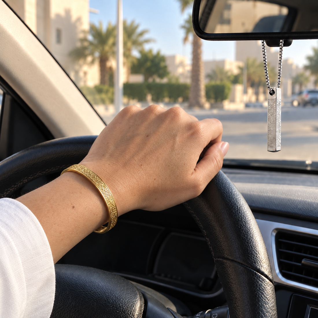 Gold bangle worn while driving